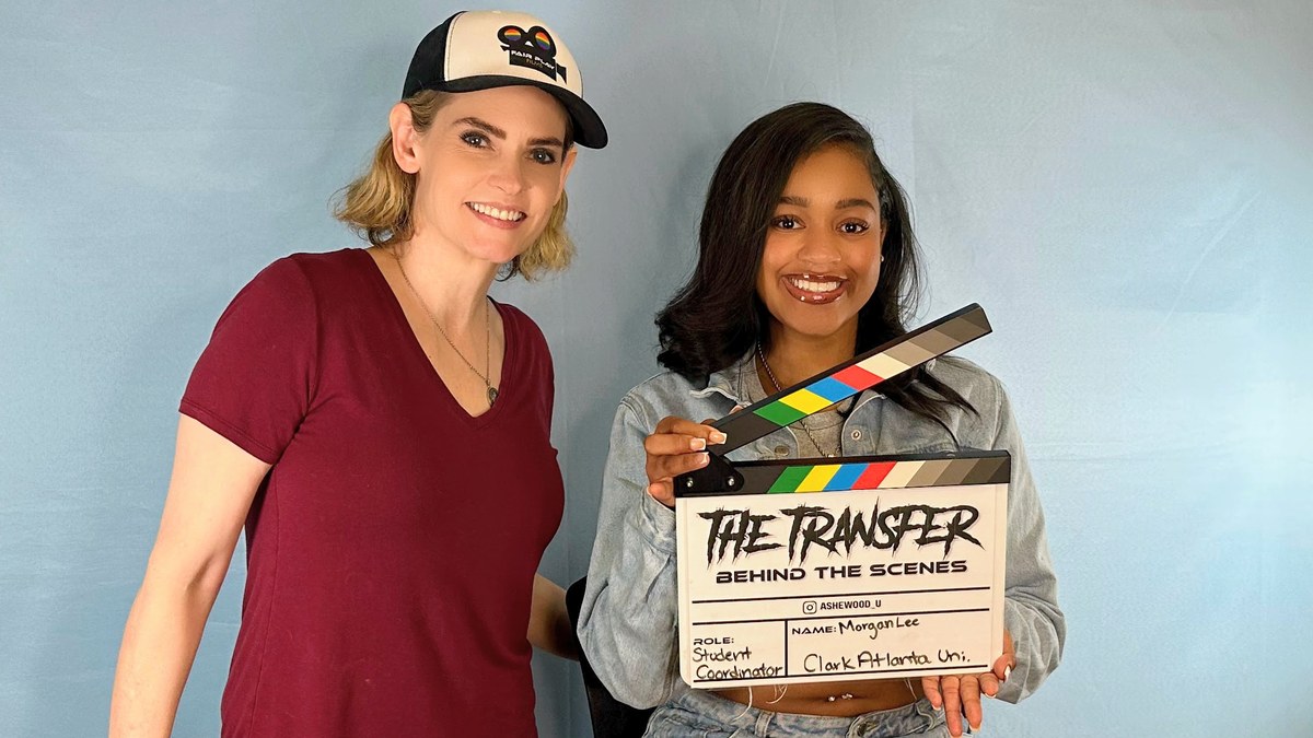 Morgan holding a behind-the-scenes slate for The Transfer alongside producer Jill Bennett